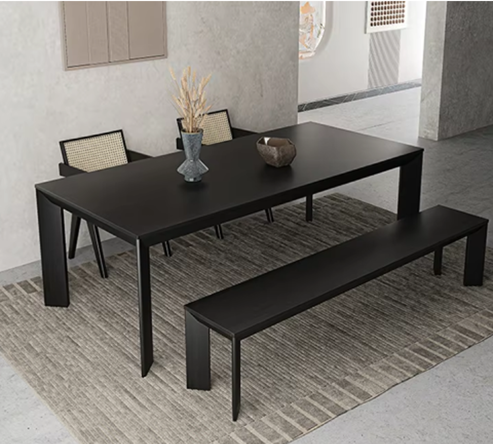 Furnology contemporary black dining table with matching bench and chairs on a textured rug