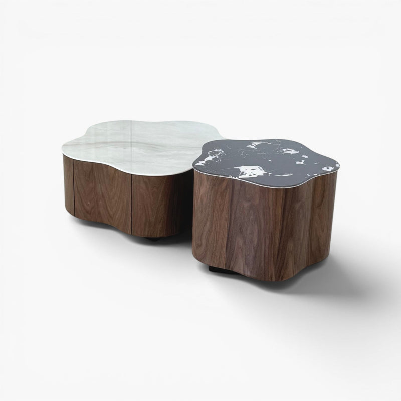 Furnology Norma nested coffee table with white and black marble tops and walnut wood bases, featuring a flower-shaped silhouette.