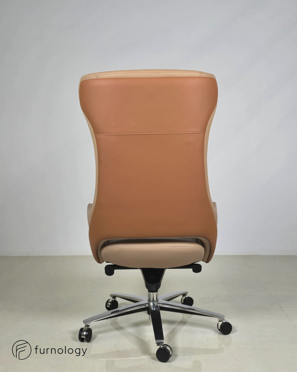Furnology luxury leatherette boss chair in tan color with chrome base and caster wheels