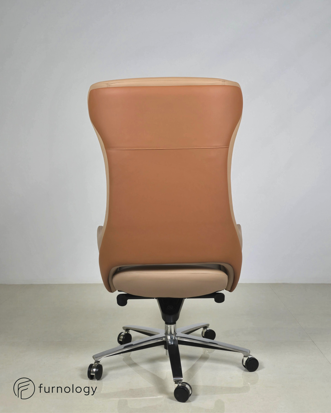 Furnology luxury leatherette boss chair in tan color with chrome base and caster wheels