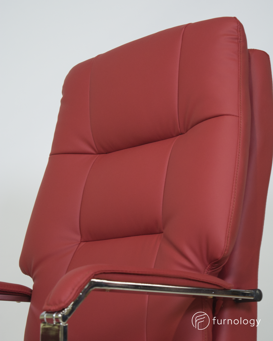 Furnology red leatherette reclining executive office chair with padded backrest and chrome armrest