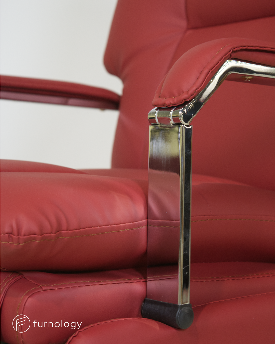 Furnology reclining executive office chair with red leatherette upholstery and chrome armrest details